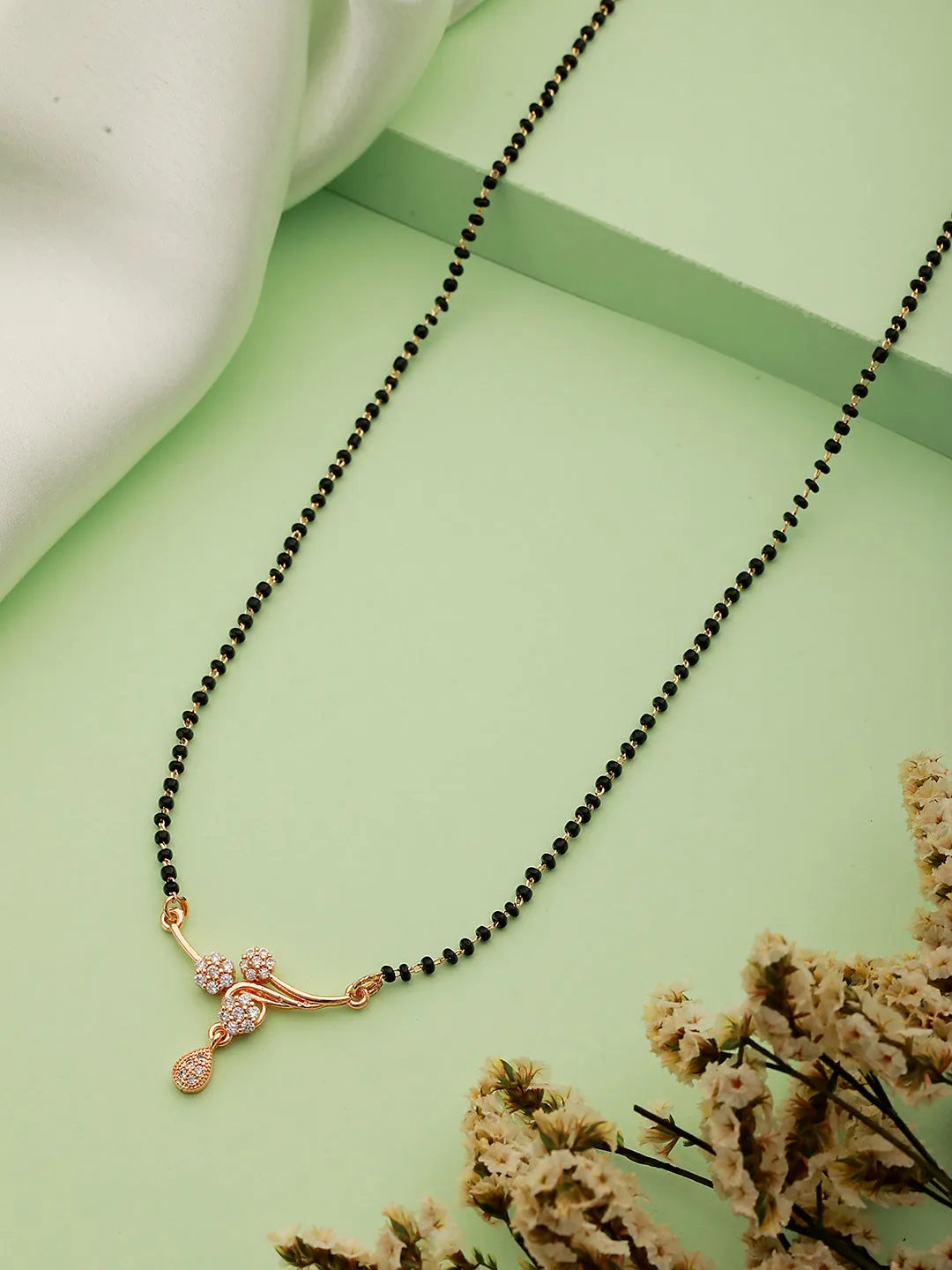Gold-Plated Black Beaded & White Ad Stone-Studded Floral Shaped Mangalsutra